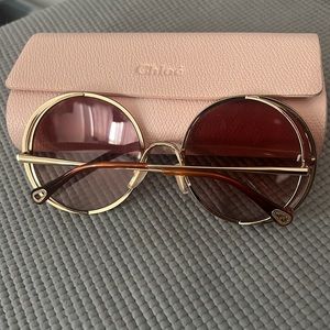 Chloe round sunglasses with gold trim . Pinkish hue . Classic and stylish !